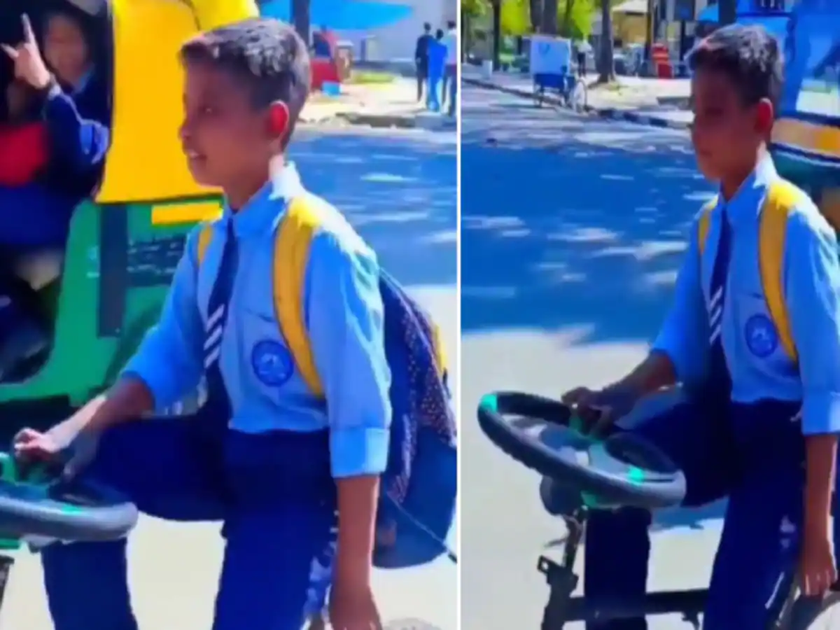 story viral video of boy fits car steering in cycle handle going to school with fun indian jugad