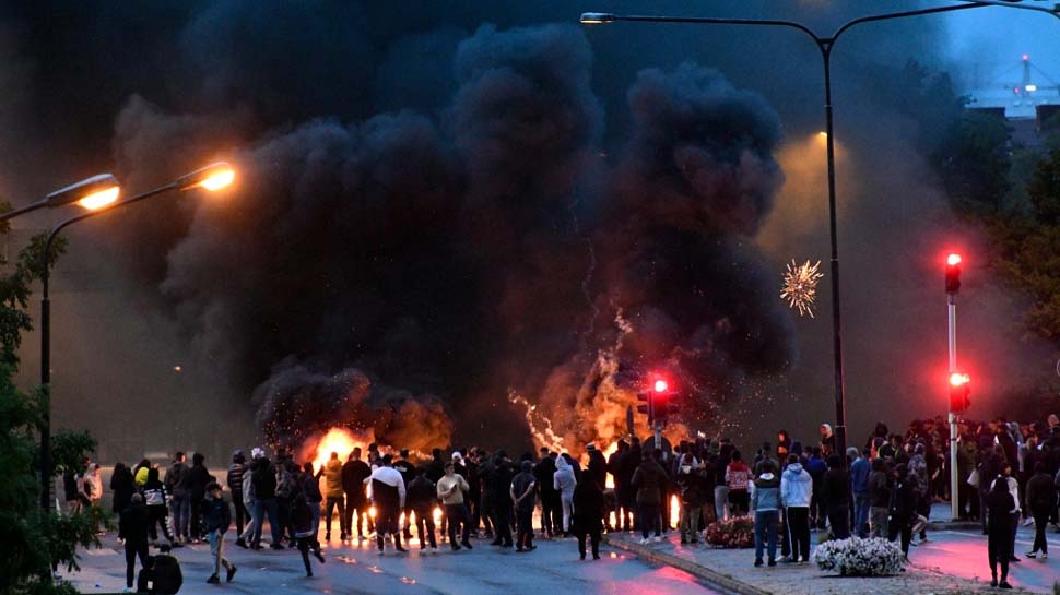 violence erupts over burning of quran copy in sweden 40 people injured many arrested