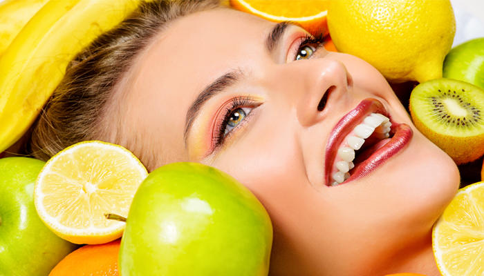 woman good skin beauty with citrus fruits