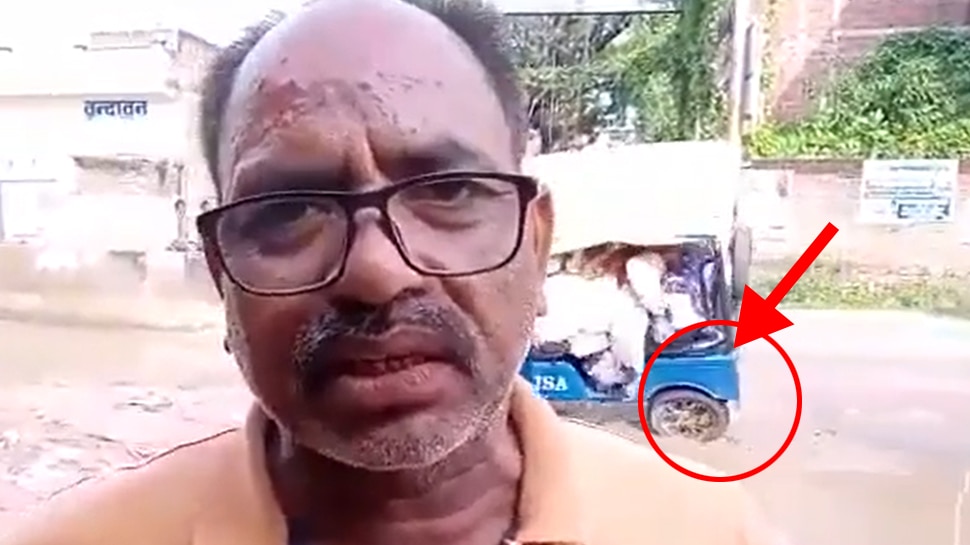 A man was complaining to a journalist about the bad road when the e rickshaw overturned in a ditch behind